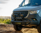 Burley Van Co Alta front bumper detail with STEDI driving lights and Mercedes-Benz grille