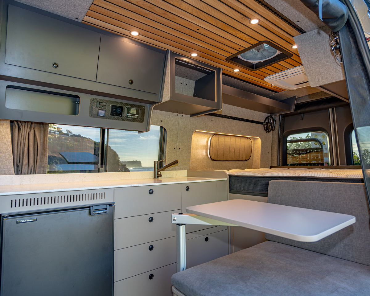 Burley Van Co Alta interior rear bed and cabinetry with doors open